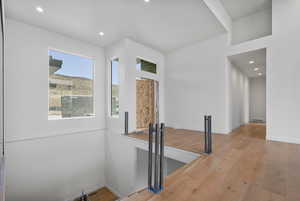 Unfurnished room with hardwood / wood-style flooring and recessed lighting
