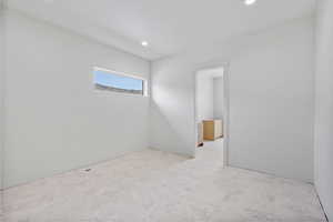 Unfurnished room featuring recessed lighting