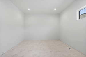 Empty room featuring recessed lighting