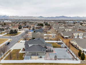 Aerial view of residential area featuring a mountain backdrop
