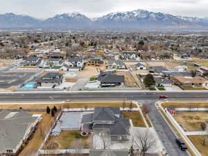 Aerial perspective of suburban area with a mountain backdrop