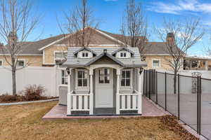 View of outdoor structure featuring a fenced backyard