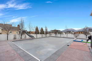 Fenced backyard featuring a residential view