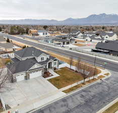 Aerial perspective of suburban area with a mountain backdrop
