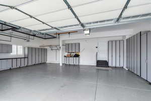 Garage featuring baseboards