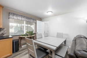 Dining area featuring light wood finished floors and baseboards