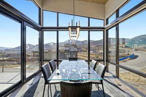 Sunroom / solarium featuring a mountain view
