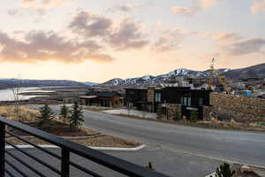 View of asphalt street featuring a mountain view