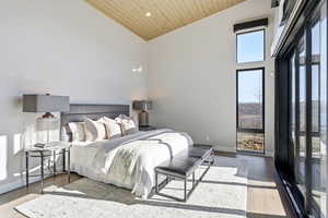 Bedroom with hardwood / wood-style flooring, a vaulted wooden ceiling, and recessed lighting