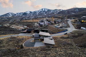 Aerial view of property's location with a mountainous background