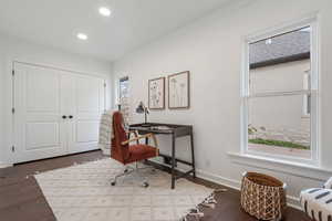 Office with crown molding, dark wood-type flooring, and recessed lighting