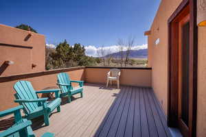 Wooden terrace featuring a mountain view