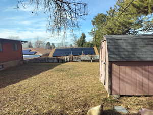 View of yard featuring a storage shed