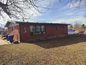 Back of house with brick siding