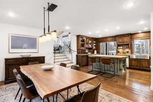Dining room featuring dark wood-style flooring and recessed lighting