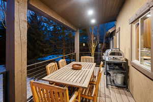 Wooden deck featuring outdoor dining space