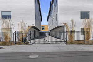 Gate featuring a fenced front yard