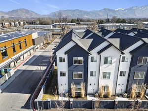 Aerial view of residential area featuring a mountain backdrop