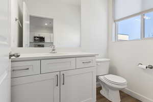 Bathroom featuring vanity and wood finished floors