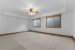 Exercise room in basement looks out to the basement family room.