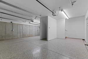 ADU has attached zero entry 2 car garage.  Stiarcase at back goes up to the art/office studio