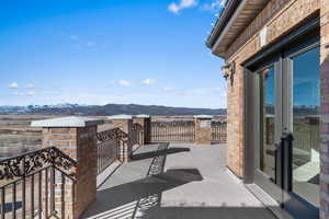 Balcony featuring a mountain view and french doors