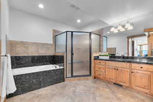 Full bath with a garden tub, a shower stall, vanity, and recessed lighting