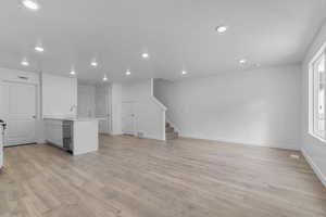 Unfurnished living room with light wood-style floors and recessed lighting