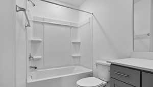 Full bath featuring bathtub / shower combination and vanity
