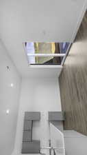 Unfurnished bedroom with a skylight