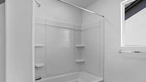 Bathroom featuring shower / washtub combination