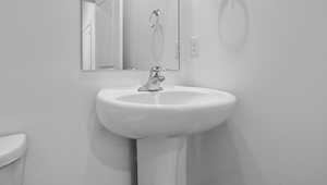 Half bath featuring toilet