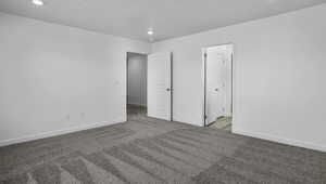 Unfurnished bedroom featuring light colored carpet and recessed lighting