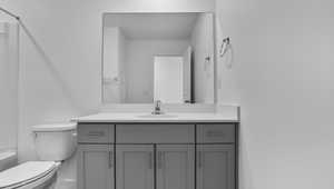 Bathroom with vanity and tub / shower combination