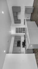Kitchen featuring gray cabinetry