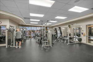 Gym with a paneled ceiling