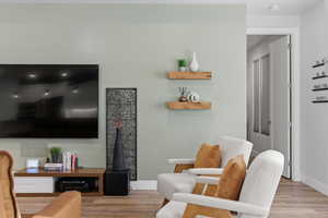 Living room featuring light wood-style flooring