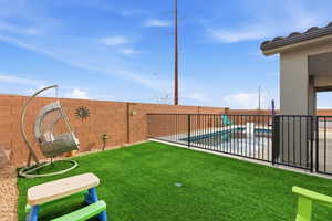 Fenced backyard with a patio