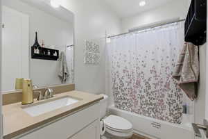 Full bathroom with vanity and shower / bath combo