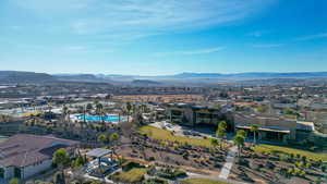 Aerial view of residential area with mountains and a pool area