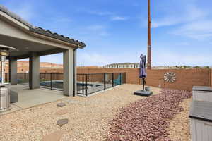 Fenced backyard featuring a patio area