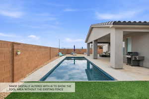 View of swimming pool with patio surround, a grill, and a fenced backyard