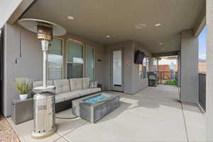 View of patio / terrace featuring an outdoor living space with a fire pit