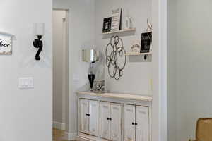 Detailed view of baseboards and wood finished floors