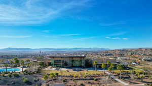 Aerial view of residential area featuring a mountainous background