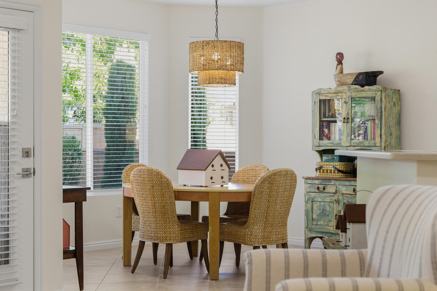 Tiled dining room with baseboards