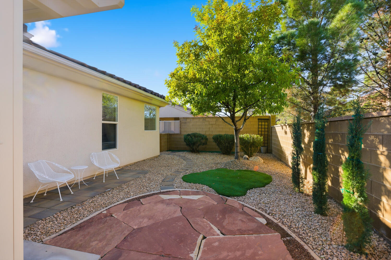 Fenced backyard with a patio area