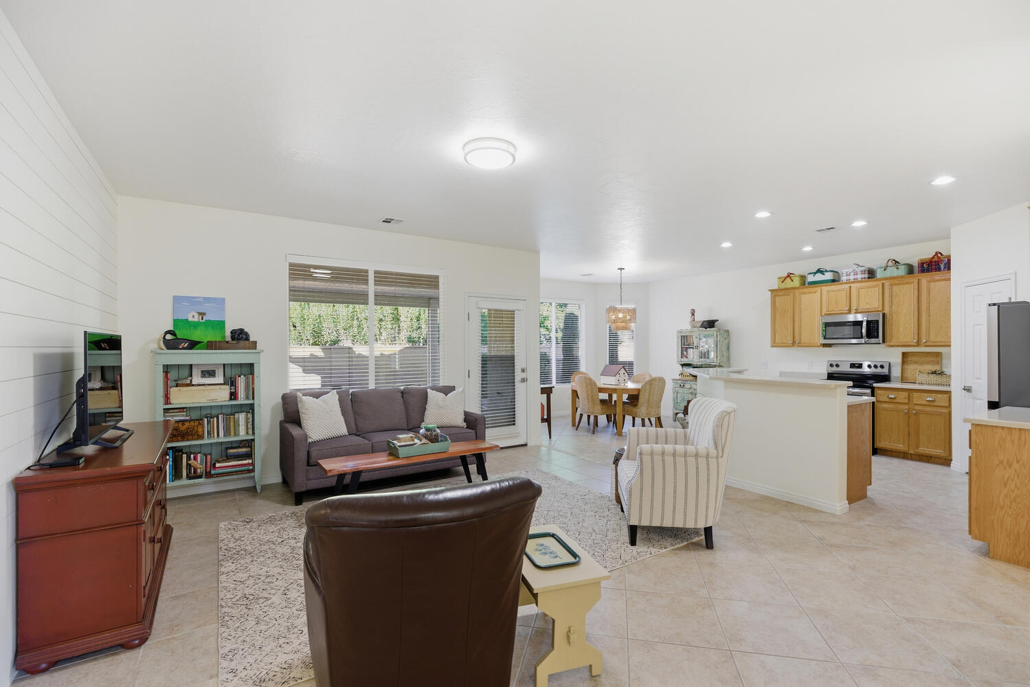 Living room featuring light tile patterned floors and recessed lighting