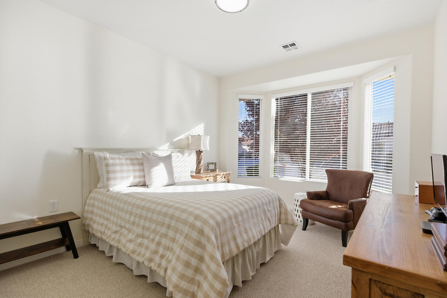 Bedroom featuring light carpet