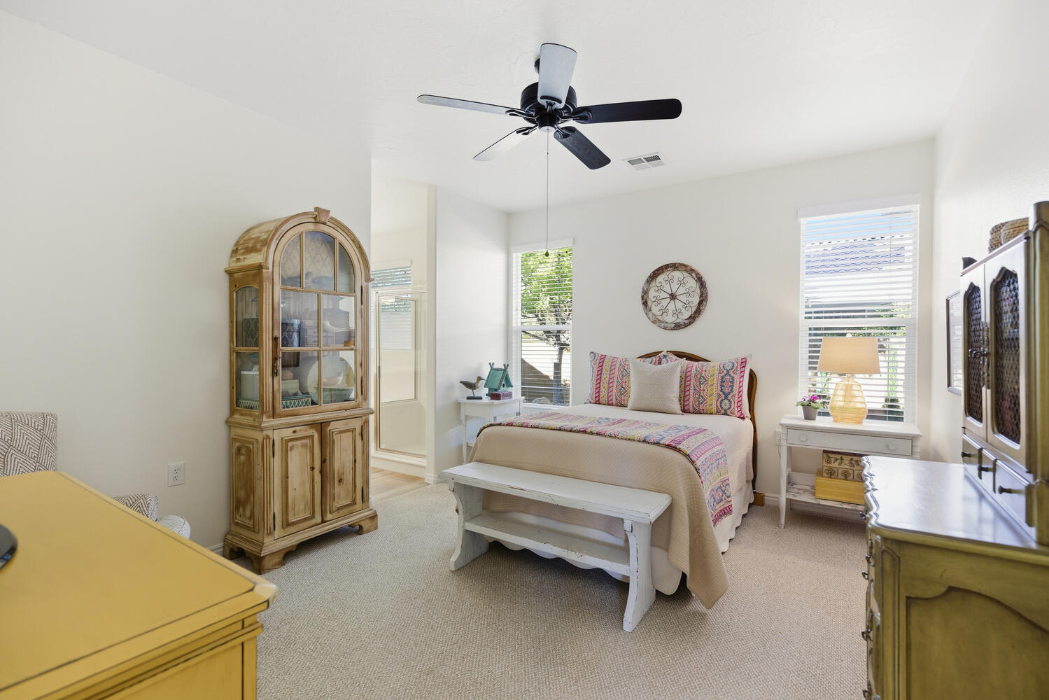 Bedroom featuring light carpet and a ceiling fan
